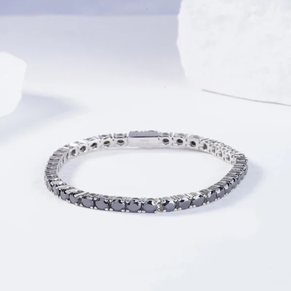 Discover the elegance of the AMIIZE Sterling Silver Luxury Engagement Bracelet, adorned with exquisite round-shaped black moissanite stones. - Image 2